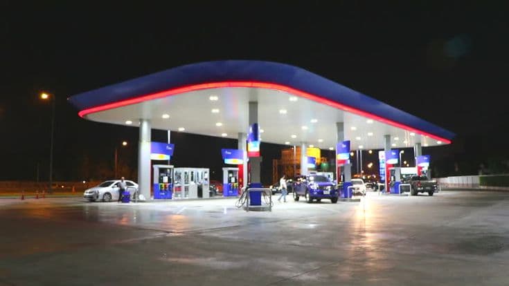 A petrol station lit up at night